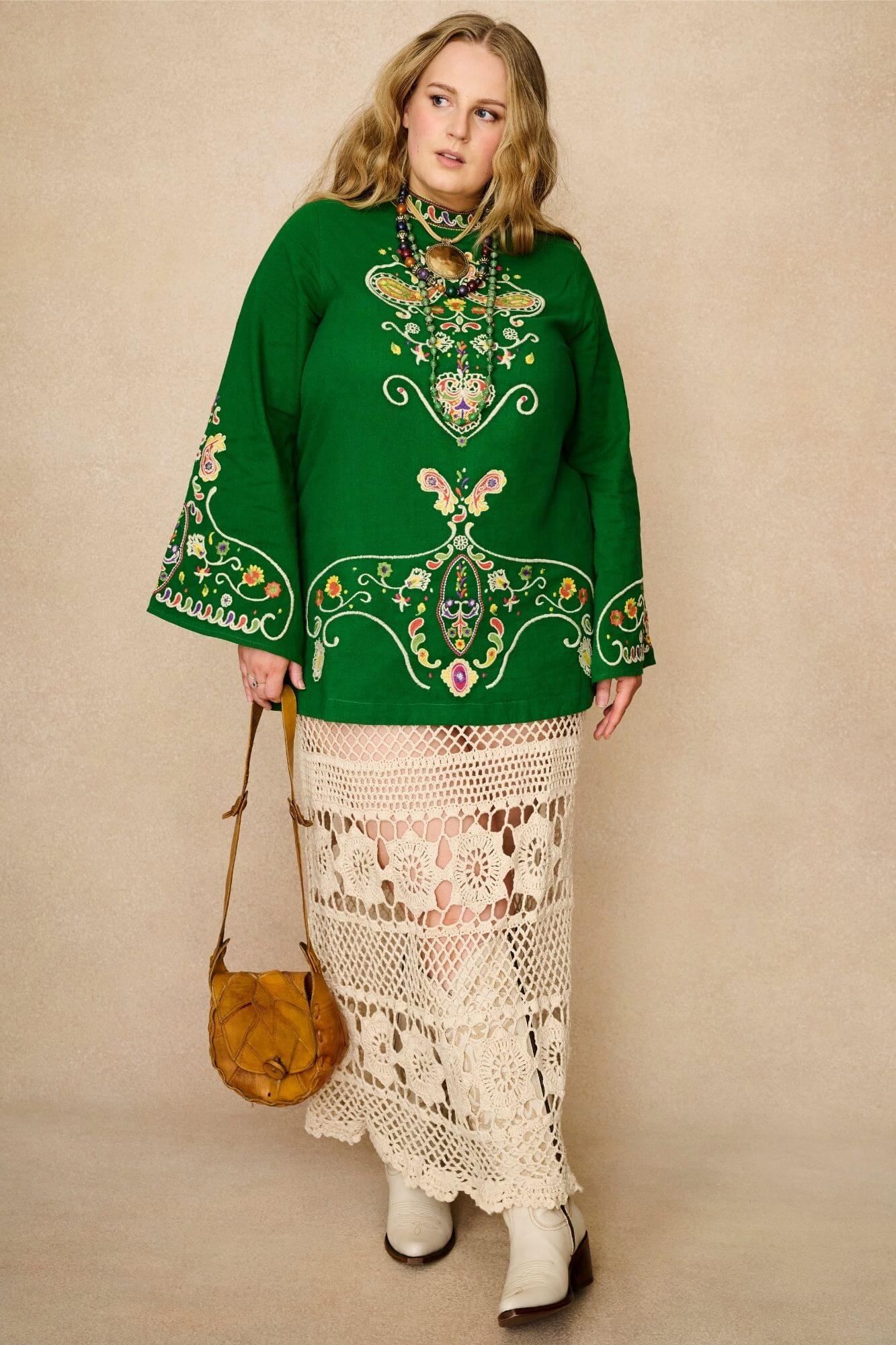 Green folk embroidered mini dress by The Hippie Shake in soft cotton with wide sleeves. A 70s-inspired boho mini dress made for festival and vintage styling - styled with crochet maxi skirt