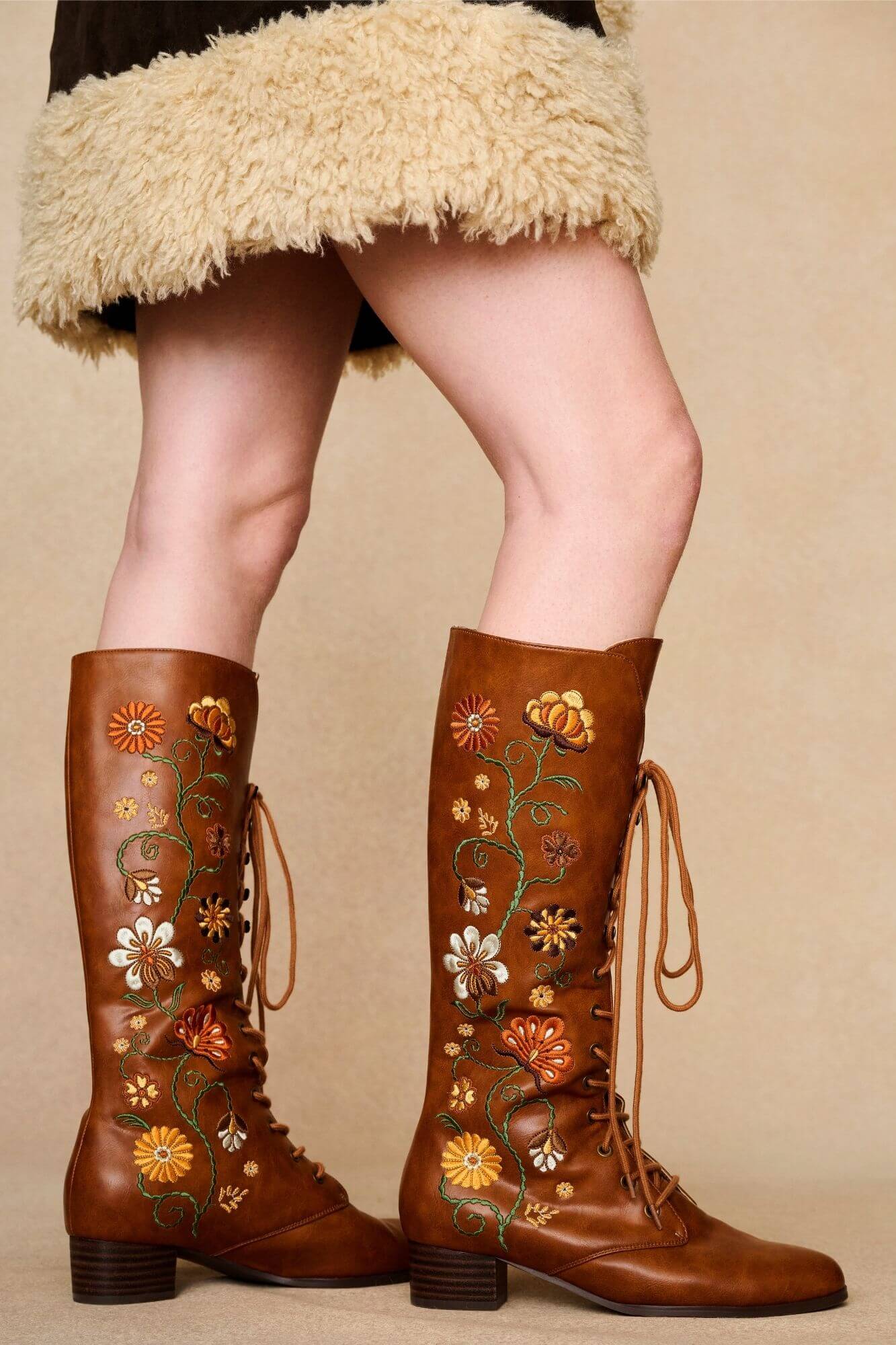 Side view brown embroidered Penny Lane boots in tan faux leather with lace-up front and block heel. Vintage-inspired boho boots by The Hippie Shake