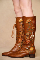 Side view brown embroidered Penny Lane boots in tan faux leather with lace-up front and block heel. Vintage-inspired boho boots by The Hippie Shake