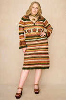 Model wears striped crochet midi dress hand crocheted in cotton with 70s-inspired detailing by The Hippie Shake