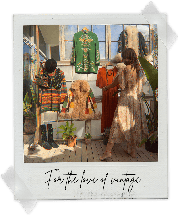 Vintage Boho & 70s Inspired fashion by The Hippie Shake hanging on the wall with founder Naomi styling the clothes