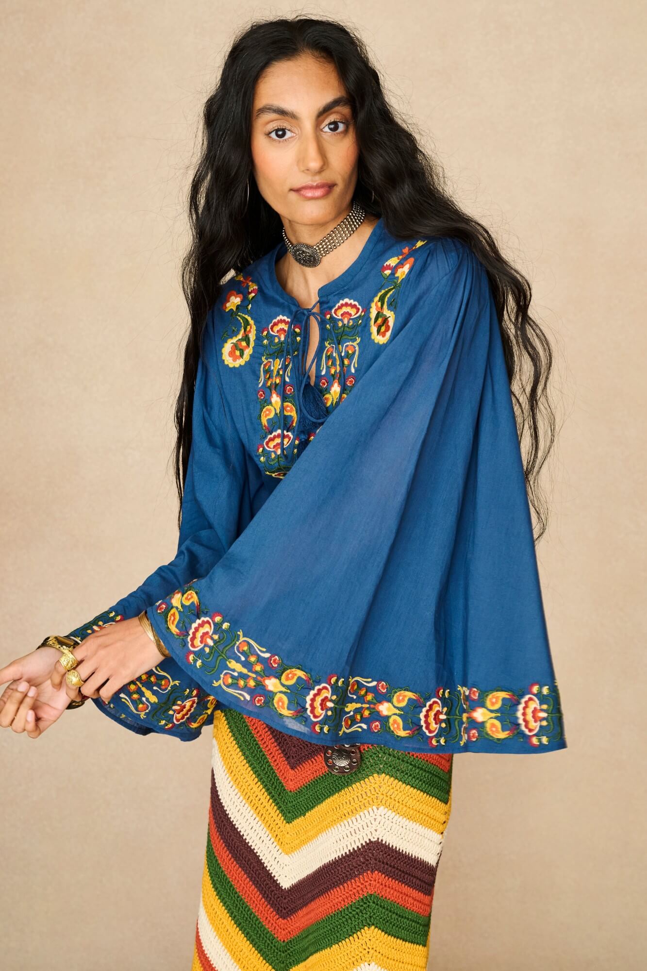 Model wearing 70s blue long sleeve top by The Hippie Shake, close up