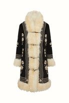 Ghost image of a long black 70s coat with cream fur trim by The Hippie Shake