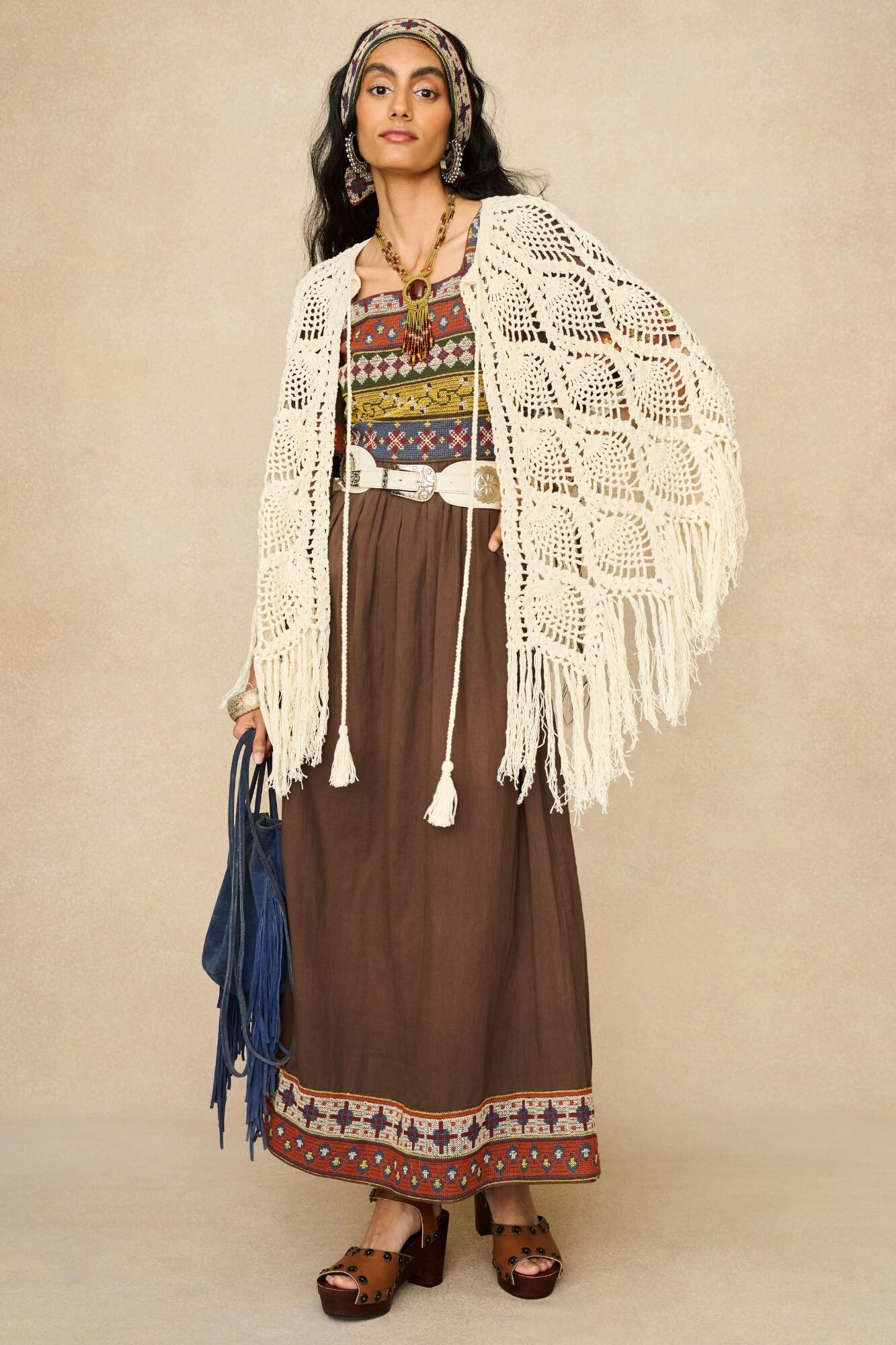 Model wearing brown embroidered maxi dress by The Hippie Shake, front view