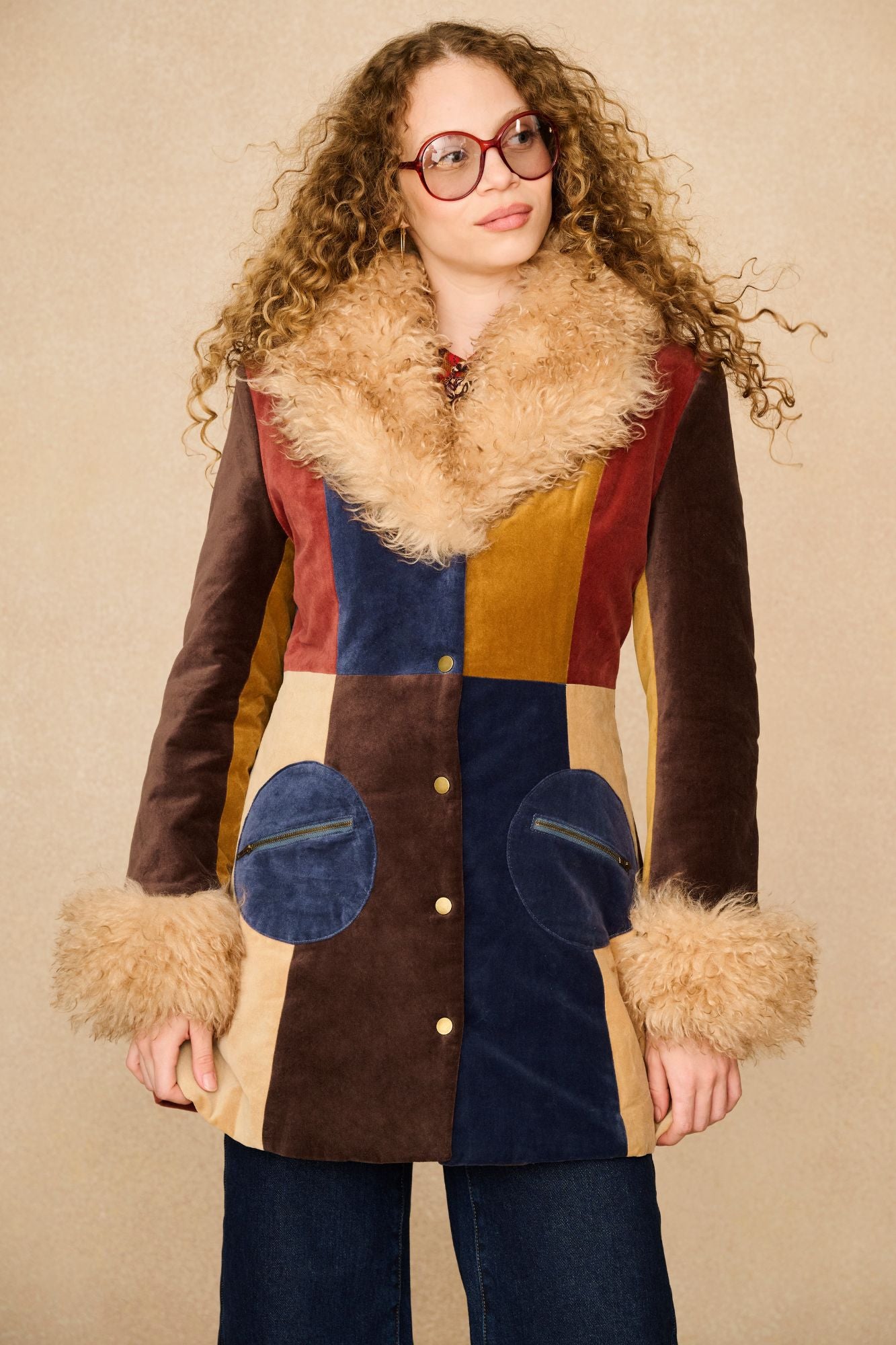 Model wearing 70s patchwork Penny Lane coat with faux fur collar by The Hippie Shake - front view