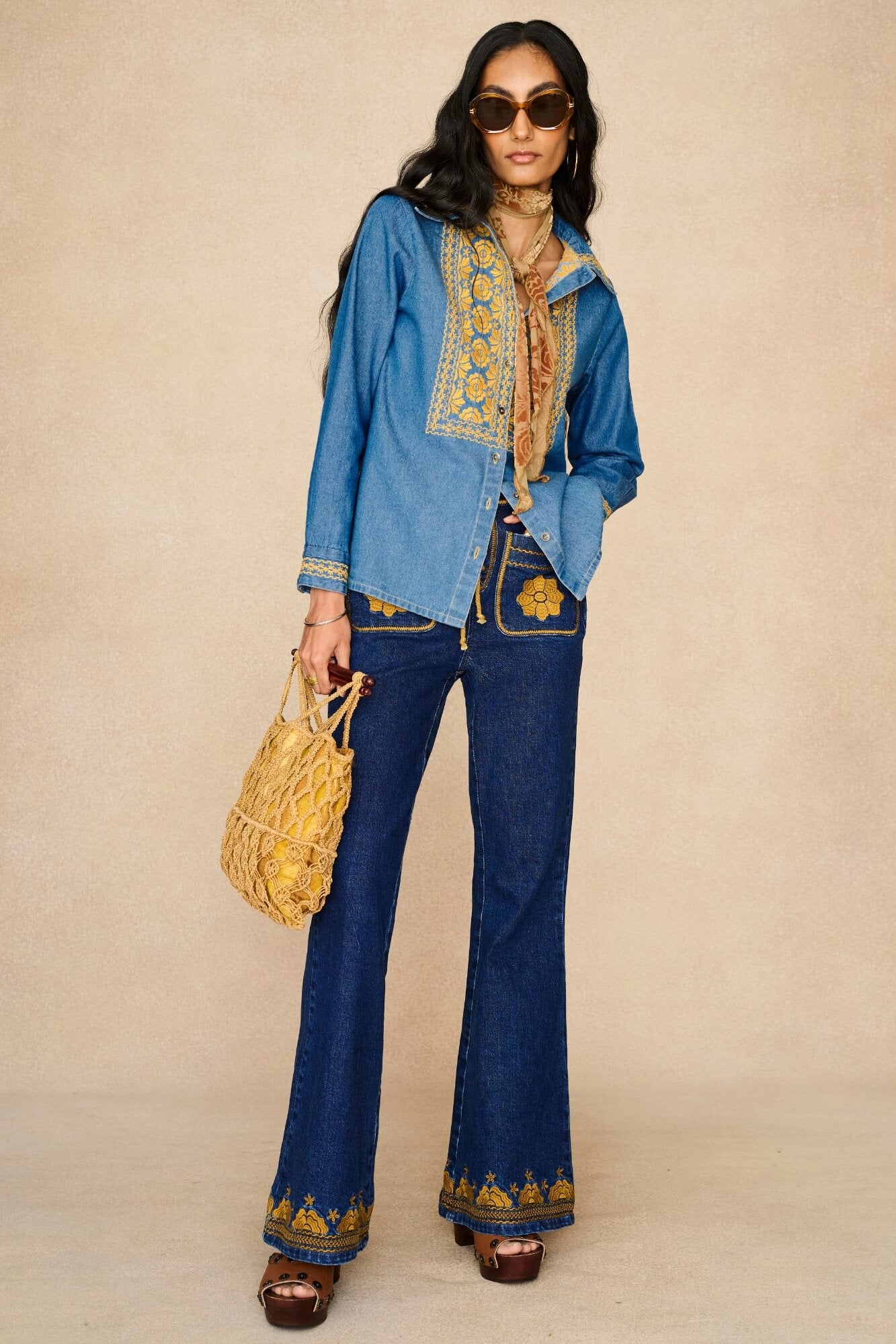 Denim Collection featuring 70s  embroidered blouse by The Hippie Shake - front view