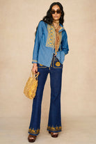Denim Collection featuring 70s  embroidered blouse by The Hippie Shake - front view