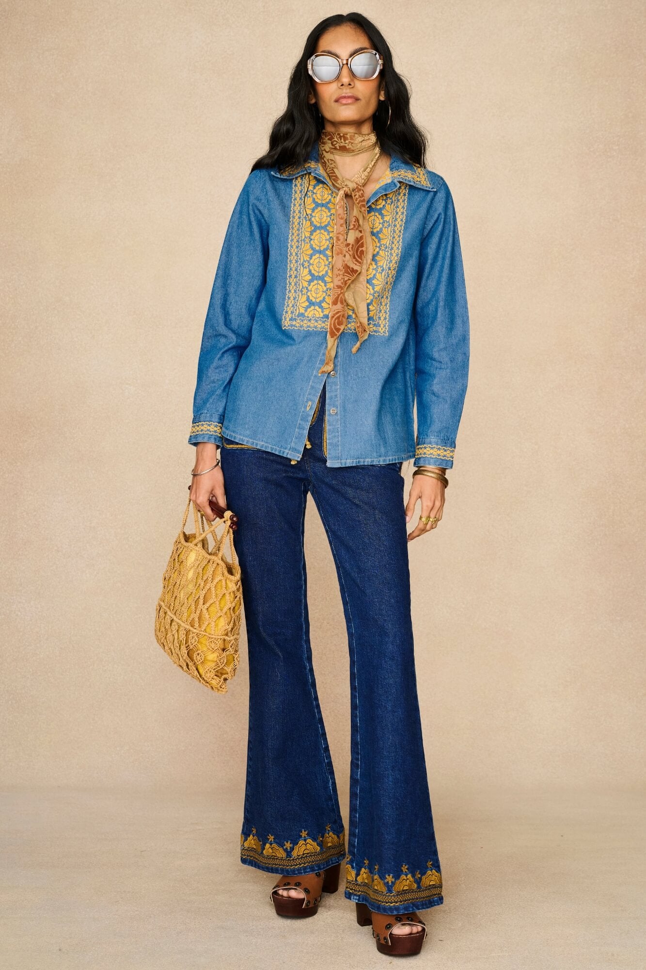 Denim Collection featuring 70s  embroidered blouse by The Hippie Shake - front view