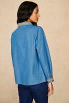 Denim Collection featuring 70s  embroidered blouse by The Hippie Shake - back view
