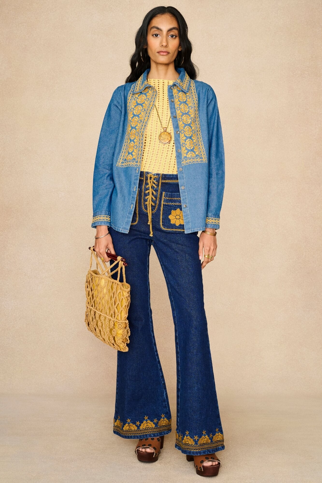 Denim Collection featuring 70s  embroidered blouse by The Hippie Shake - front view