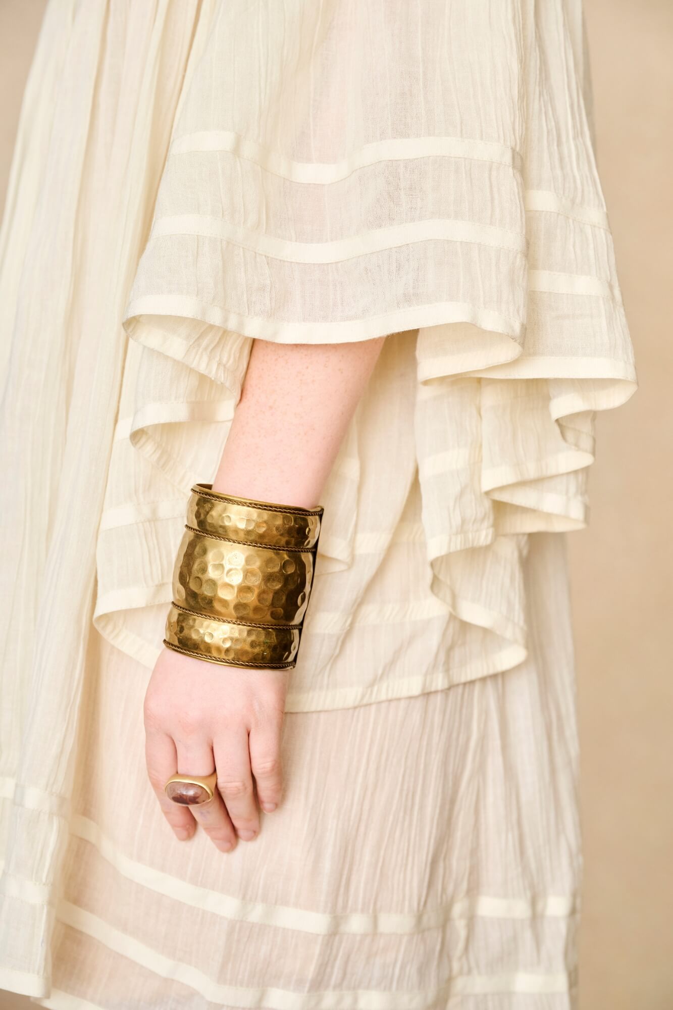 Model wearing 70s cream mini dress with lace-up Penny Lane boots by The Hippie Shake, detail view