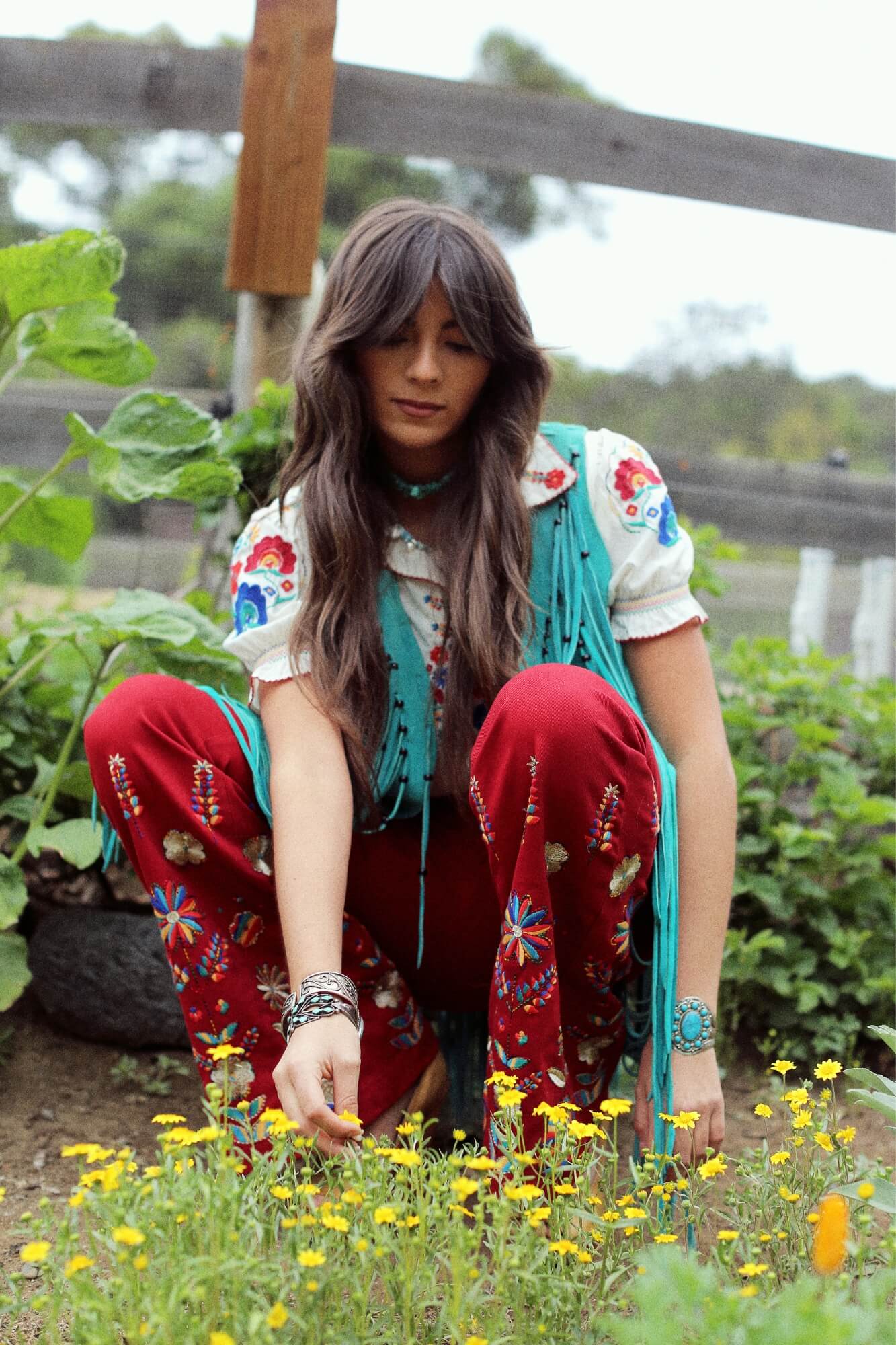 Festival collection featuring white boho top with red bell bottoms by The Hippie Shake