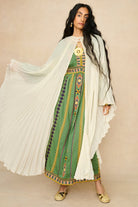 Model wearing 70s cream cape by The Hippie Shake, front view