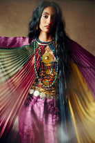 Model wearing rainbow striped cape by The Hippie Shake, front view