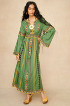 Model wearing 70s green embroidered maxi dress by The Hippie Shake, front view