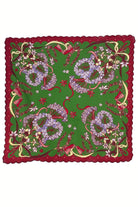 Green scarf with floral patterns and red border on a white background
