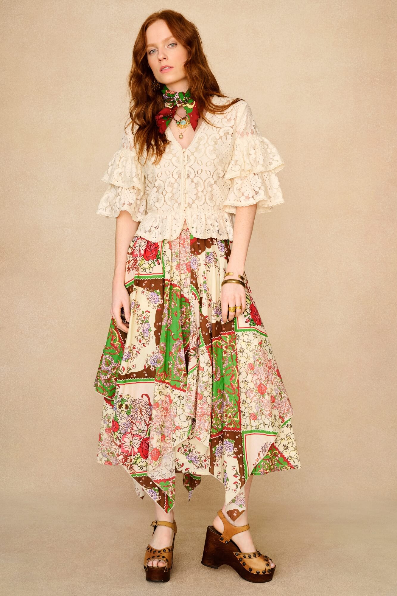 Woman wearing a floral dress with a beige background