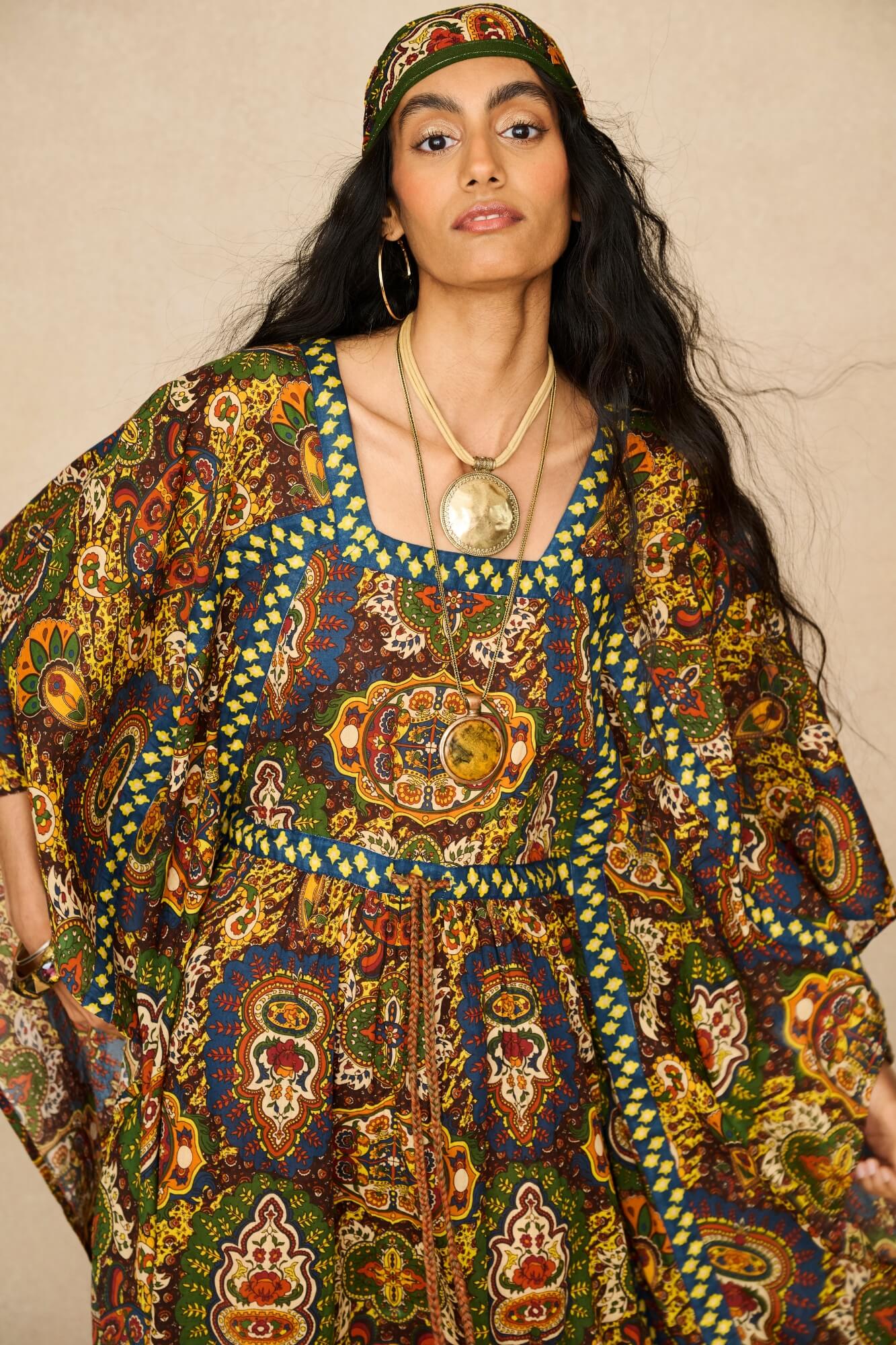 Model wearing 70s printed kaftan by The Hippie Shake, close up