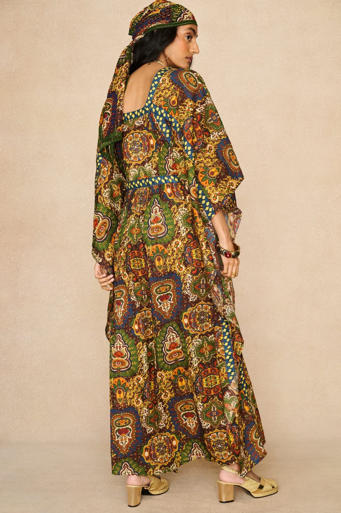 Model wearing 70s printed kaftan by The Hippie Shake, back view
