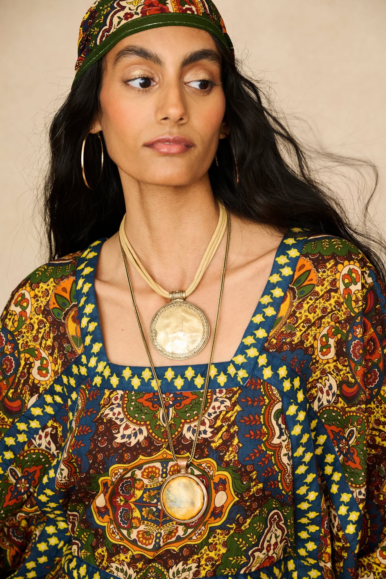 Model wearing 70s printed kaftan by The Hippie Shake, close up