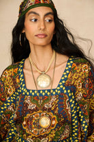 Model wearing 70s printed kaftan by The Hippie Shake, close up