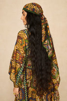 Model wearing 70s printed kaftan by The Hippie Shake, back view