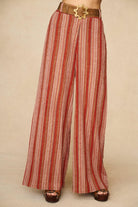 Model wearing striped pants inspired by 70s style with matching striped vest for co-ord outfit, by The Hippie Shake, close up