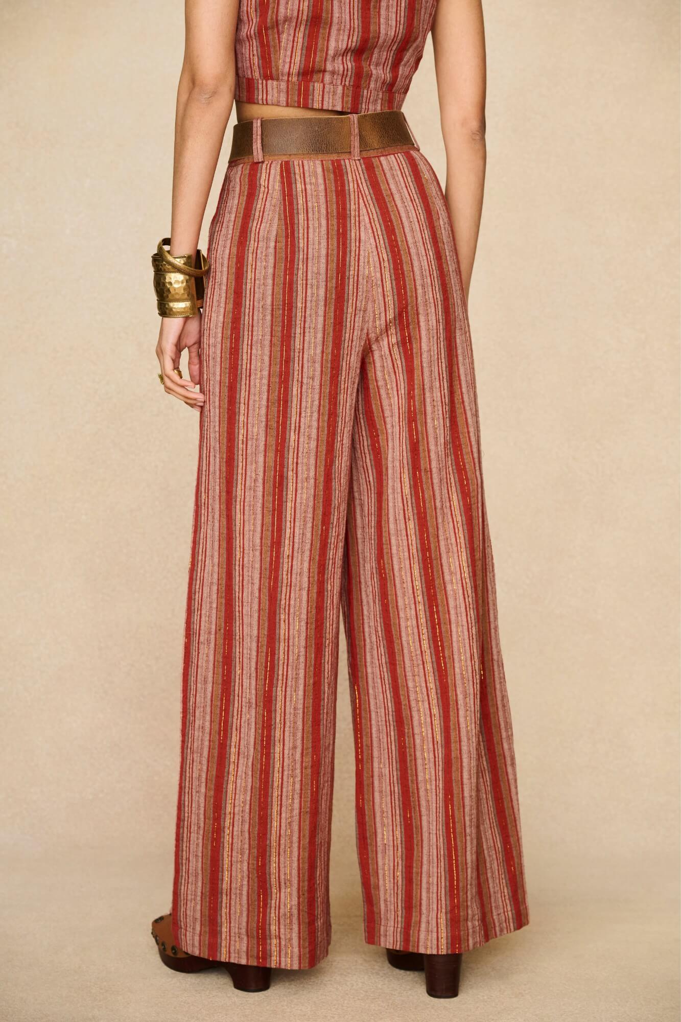 Model wearing striped pants inspired by 70s style with matching striped vest for co-ord outfit, by The Hippie Shake, back view