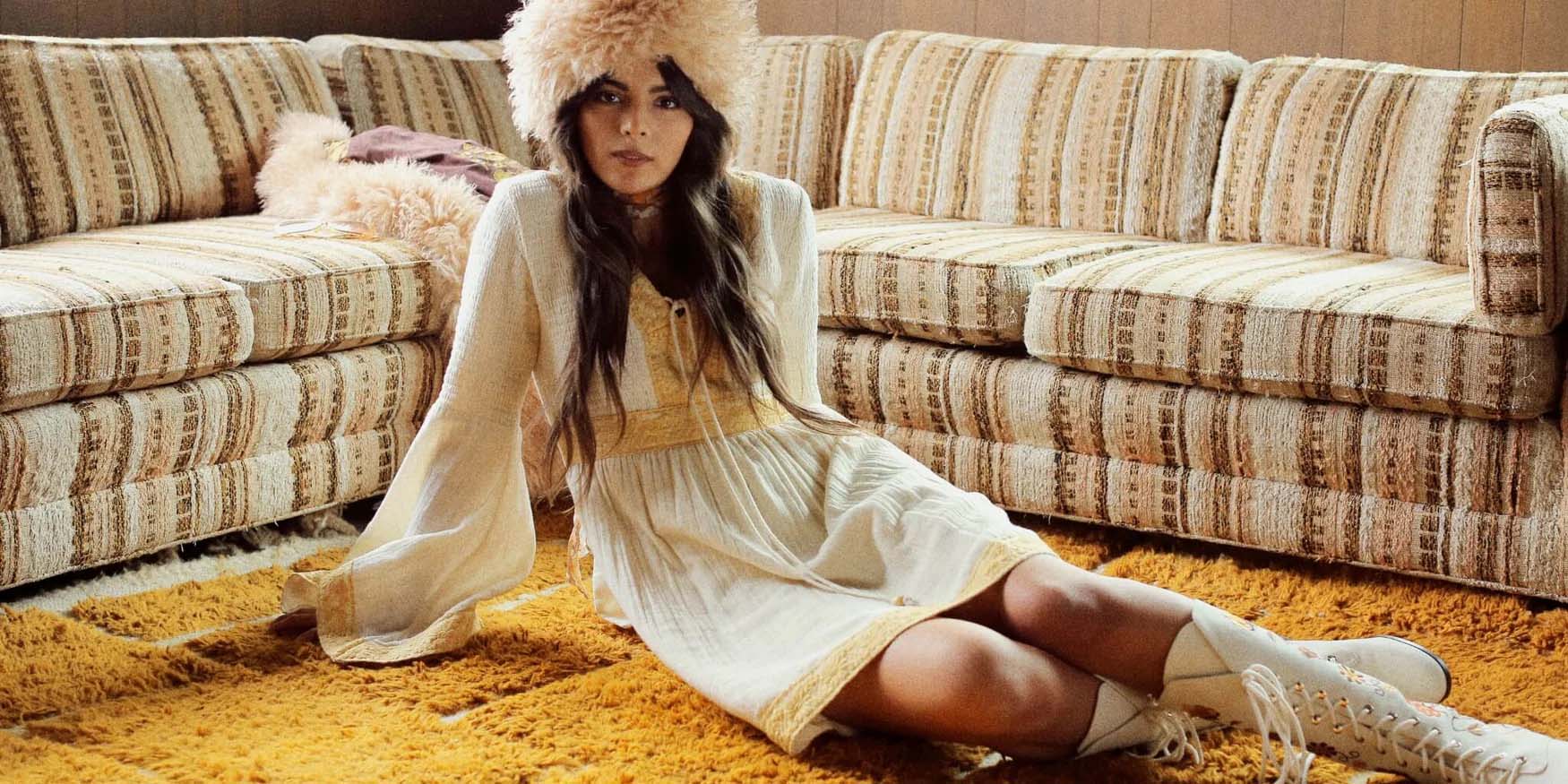 The Hippie Shake Heroes collection banner with model in bohemian mini dress and penny lane boots